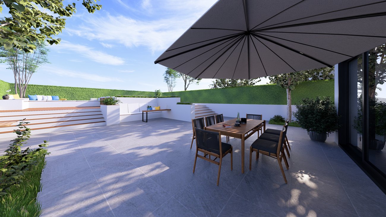 Terraza elevada con zona de comedor exterior y vistas al jardín.